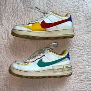 Nike Air White Sneakers with Red, Yellow, and Teal Accents
